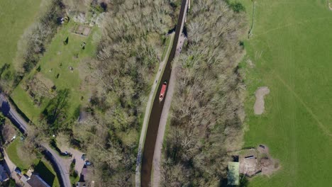 A-Narrow-Boat-Crossing-the-Pontcysyllte-Aqueduct-famously-designed-by-Thomas-Telford,-located-in-the-beautiful-Welsh-countryside,-famous-canal-route