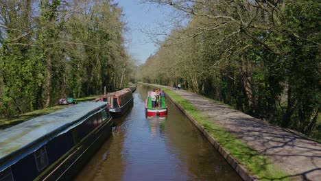 A-Narrow-Boat-heading-down-stream-to-Cross-the-Pontcysyllte-Aqueduct,-famously-designed-by-Thomas-Telford,-located-in-the-beautiful-Welsh-countryside,-the-Llangollen-Canal-route