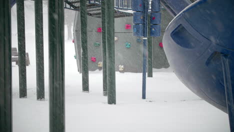 Playground-Equipment-During-Snow-Storm-TILT-UP-SLOW-MOTION