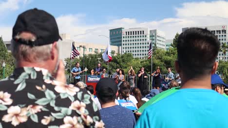 About-2500-people-gathered-for-Bernie-Sanders-Political-rally-in-San-Jose,-CA-at-Guadalupe-River-East-Arena-Green,-slow-motion-clapping-and-singing-as-he-campaigns-for-presidential-election-2020