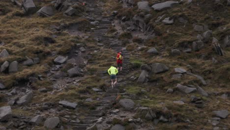 Mountain-marathon-runners-on-a-cold-and-rainy-day-competing-in-a-race-in-winter