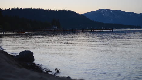 Calm-Waves-Crash-Against-Pier-in-Lake-Tahoe-in-the-Early-Morning
