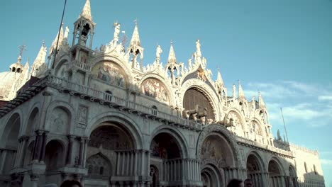 Closeup-of-Saint-Marks-Basilica-with-afternoon-shadows-cast-on-the-facade,-Italy