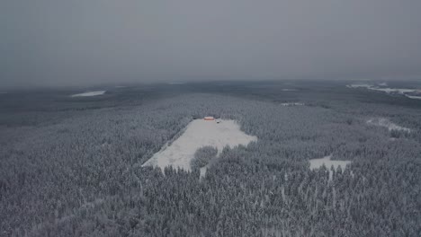 Aerial-view-of-frozen-mountain-top-in-deep-forest
