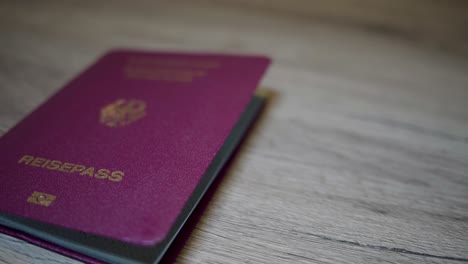 German-passport-lies-on-a-wooden-table
