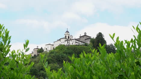 A-view-from-the-distance-of-the-Sacred-Mountain-of-Varallo,-a-christian-devotional-complex,-a-unesco-world-heritage-si-in-Italy