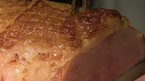 Close-Up-Of-Honey-Glazed-Ham-Being-Sliced