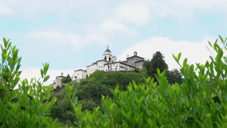 A-view-from-the-distance-of-the-Sacred-Mountain-of-Varallo,-a-christian-devotional-complex,-a-unesco-world-heritage-si-in-Italy