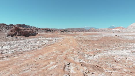 Aerial-action-shot-near-the-ground-of-salt-desert-of-Atacama,-Chile,-South-America