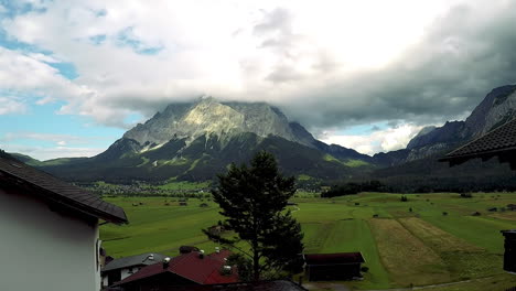 The-Zugspitze-mountain-seen-across-a-lush-green-valley-in-the-alps