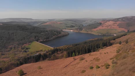 Drone-travelling-away-from-Lady-Bower-Reservoir-Whilst-panning-down-hiding-Lady-Bower-Reservoir-towards-Bamford-Edge-shot-in-4K