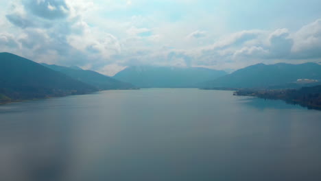 Slow-aerial-pan,-Tegernsee-on-a-cloudy-day-seen-from-high-up