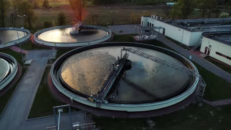 Aerial-view-of-sewage-treatment-plant,-camera-moving-around