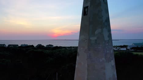 Droning-backwards-revealing-a-beautiful-sunset-and-sky-over-Bald-Head-Island-North-Carolina