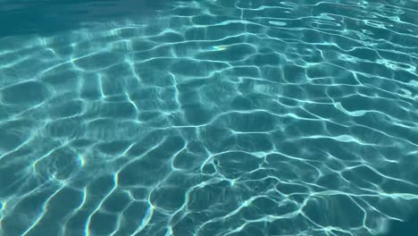 Swimming-pool-water-patterns-with-reflections-from-sunlight