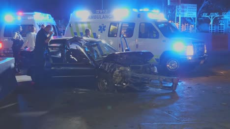 A-policeman-investigating-the-damage-after-a-car-crash