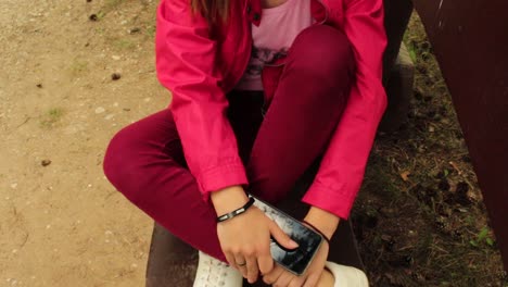 Girl-with-red-jacket-sitting-in-the-park