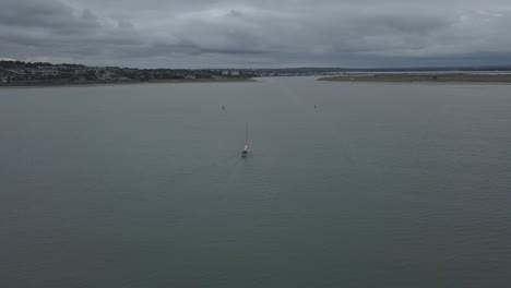 Aerial-view-of-a-boat-coming-in-to-dock-at-a-small-Irish-village-of-Malahide