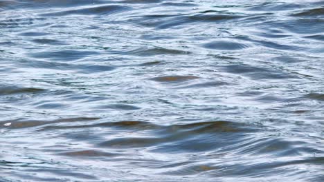 Close-up-shot-of-silky-smooth-ocean-waves,-slow-motion,-background,-hiding-treasure