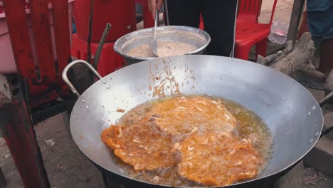 Wide-Shot-of-Shrimp-Cakes-Frying-at-the-Side-of-the-Road