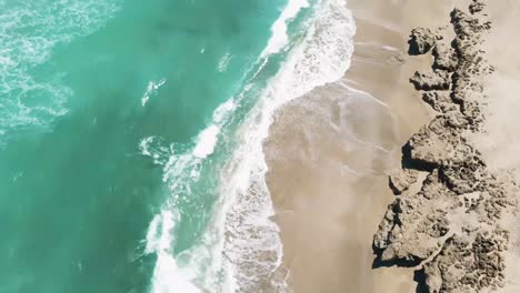 Jensen-Hutchinson-Island-coast-line-turquoise-water-alone-the-shoreline,-drone-view