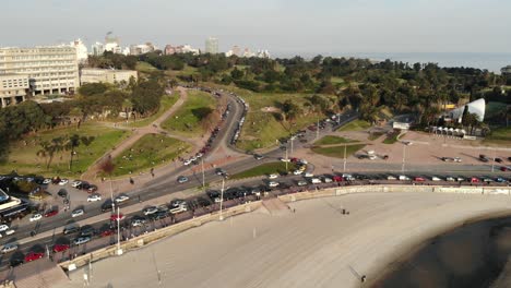 aerial-shot-of-traffic-in-the-park-and-the-beach-located-in-Montevideo-Uruguay
