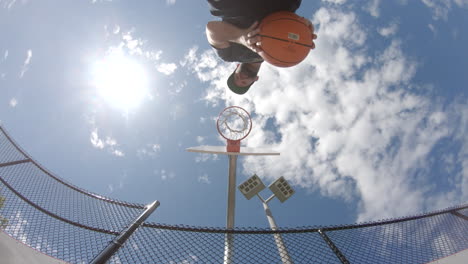 Basketball-shot-unique-outdoor-court-athletics-on-sunny-day-in-a-park