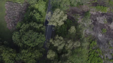 Drone-aerial-tracking-birds-eye-view-shot-of-car-in-countryside