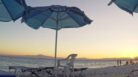 Wide-footage-at-Almyros-beach,-Kalamata,-Greece-during-sunset