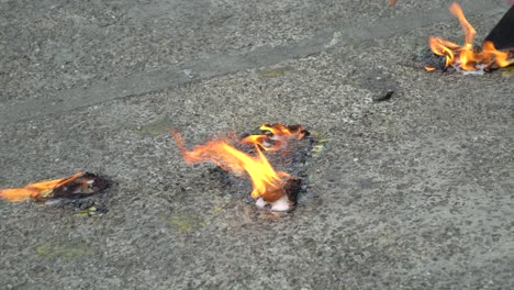 Removing-paint-on-asphalt-with-fire-on-the-street-in-Thailand