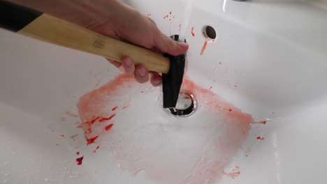 A-Bloody-Murder-Weapon-being-Washed-by-Serial-Killer,-4K,-Fake-Blood