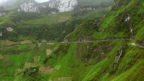 A-scenic-road-cut-into-the-mountains-of-the-gorgeous-Ma-Pi-Leng-Pass-in-northern-Vietnam