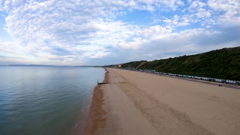 Aerial-Drone-Footage-along-Boscombe-Beach,-Bournemouth,-Dorset