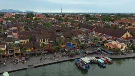 Aerial-view-of-Hoi-An-in-Vietnam-orbiting-boats-and-buildings