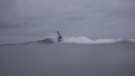 Asian-Filipino-Surfers-Enjoying-Small-Waves-In-Gloomy-Weather