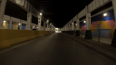 drive-through-a-long-tunnel-with-baseball-art-on-walls-4k