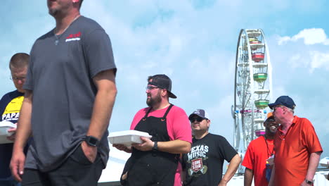 BBQ-Competition-cooks-turning-in-their-BBQ-plates-to-the-judges-at-the-Austin-Rodeo-BBQ-Competition