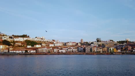 Stunning-view-from-Bairro-da-Ribeira-riverfront-in-Porto-looking-to-south-side-of-Douro-River,-Portugal