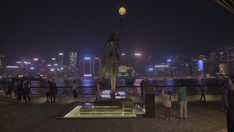 Gimbal-shot-of-the-Tsim-Sha-Tsui-waterfront-by-night---the-Hong-Kong-Film-Awards-statue
