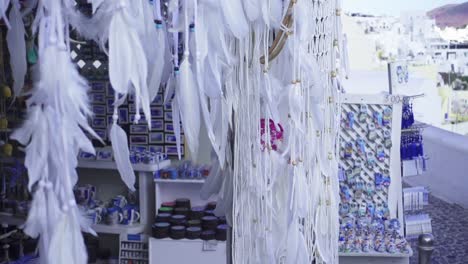 Close-up-of-white-dreamcatchers-at-the-entrance-to-a-local-art-shop-in-Santorini