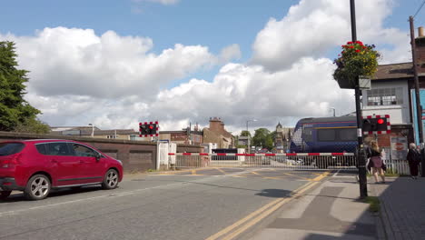 Train-Passing-a-Level-Crossing-with-Cars-Waiting-in-Slow-Motion