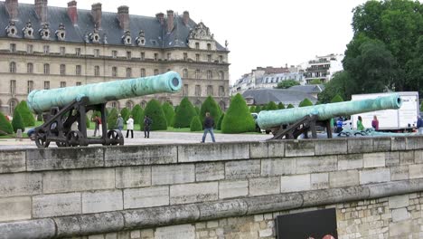 Two-old-cannons-in-front-of-the-Army-Museum,-in-Paris,-France