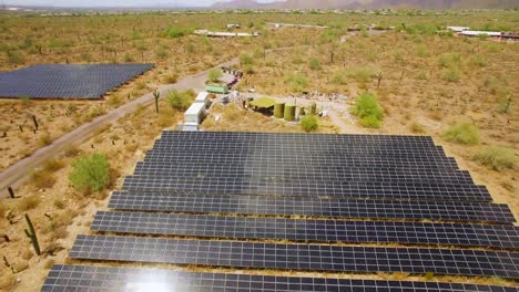 Aerial-close-up-pull-back-from-an-array-of-solar-panels-in-the-Sonoran-desert-near-Taliesin-West,-Scottsdale,-Arizona-Concept:-environment,-alternative-energy,-solar-power