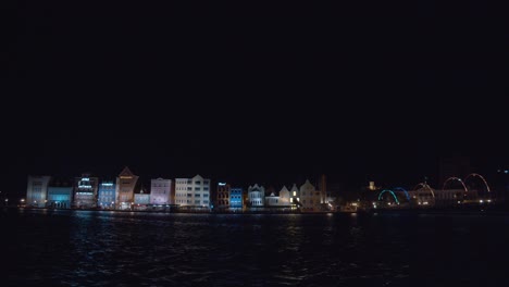 A-timelapse-of-St-Anna-Bay-with-the-waterfront-city-of-Willemstad,-Curacao-in-the-background