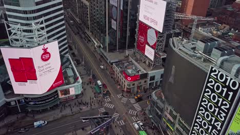 Flying-High-Over-Christmas-Shop-Ads-at-Yonge-Dundas-Square-in-Toronto