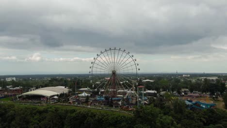 Drone-aerial-view-of-Sky-Ranch-eye,-top-of-the-mountain-shot-of-theme-adventure-park-ferris-wheel