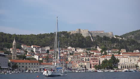 View-from-sea-looking-in-at-marina-of-Hvar,-Croatia-filled-with-boats