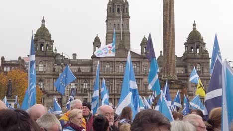 A-slow-motion-and-close-up-of-a-crowd-shot-of-people-with-the-Glasgow-City-Chambers-in-the-background