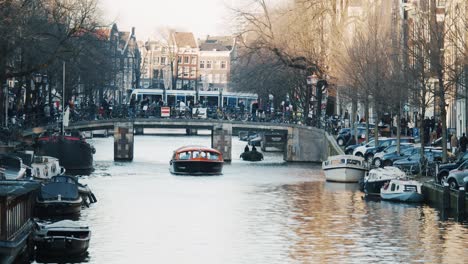 Typical-view-of-an-excursion-boat-in-the-canals-of-Amsterdam-in-winter