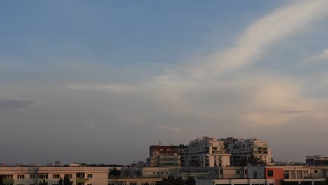 Bucharest,-Romania-8November:-Time-lapse-of-the-blue-sky,-in-a-day-with-clouds-and-constructions-in-the-back-of-the-view